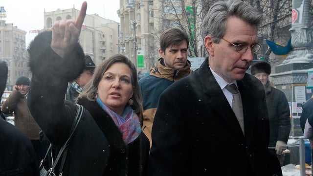 U.S. Assistant Secretary of State Victoria Nuland, left, walks with U.S. Ambassador to Ukraine Geoffrey Pyatt, through the Independence Square in Kiev 