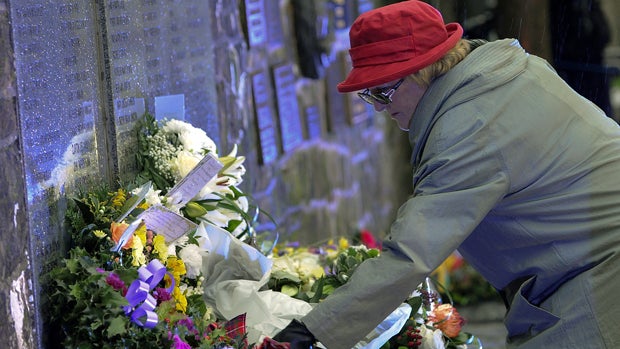 Families, relatives and dignitaries gather to pay their respects at the memorial service in Dryfesdale cemetery to commemorate the 25th anniversary of the bombing of Pan Am flight 103 in Lockerbie, Scotland, Dec. 21, 2013. 