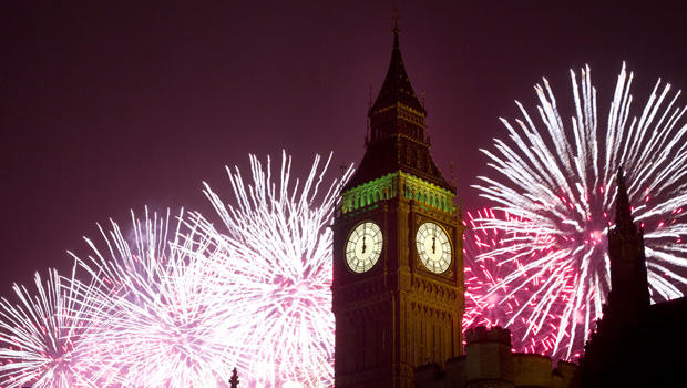 Fireworks explode over the Houses of Parliament, including Queen Elizabeth II tower which holds the bell known as Big Ben as London celebrates the arrival of New Year's Day 