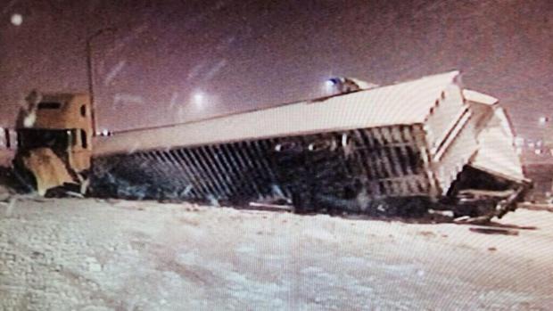 A jackknifed tractor-trailer caused the closure of a stretch of Interstate 95 in Philadelphia in heavy snow Jan. 3, 2014. 