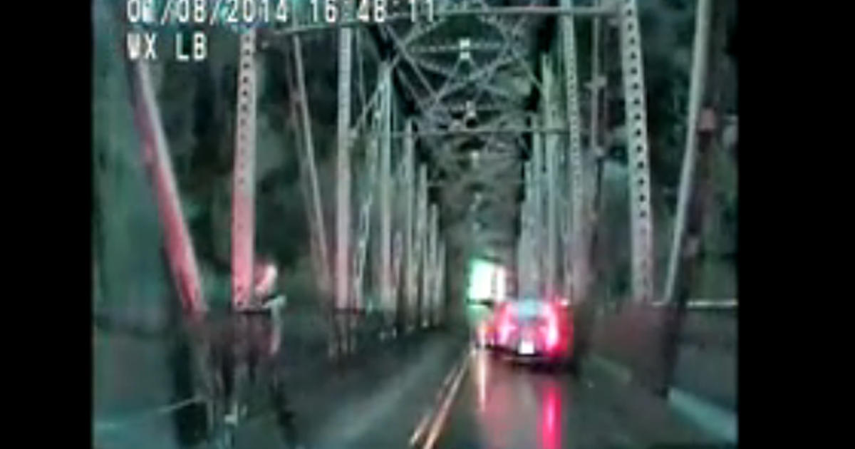 VIDEO Woman jumps off bridge in an attempt to flee police CBS News