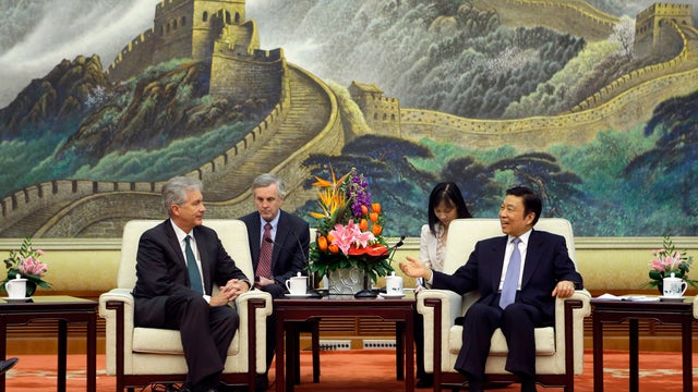 China's Vice President Li Yuanchao, right, talks with U.S. Deputy Secretary of State William Burns, left, during a meeting at the Great Hall of the People, in Beijing 
