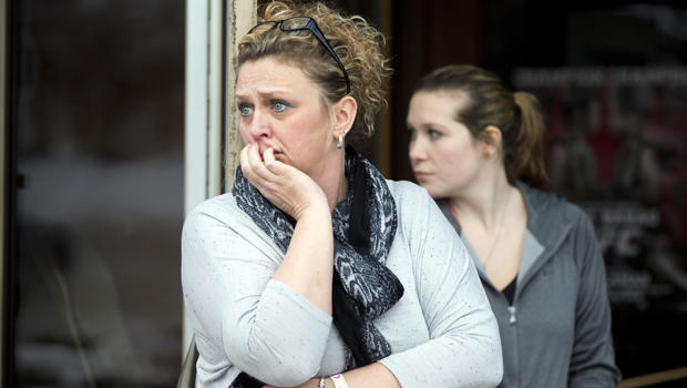 Restaurant general manager Heather Saffield and employee Chelsea Borschart, right, look outside their restaurant at The Mall in Columbia Jan. 25, 2014, in Columbia, Md. 