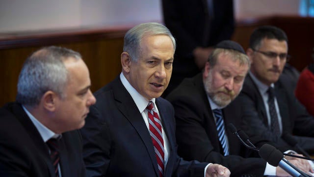 Israel's Prime Minister Benjamin Netanyahu, center, attends the weekly cabinet meeting in Jerusalem 