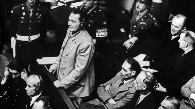 Reichsmarshal Hermann Goering makes his statment in the prisoner's dock at the Nuremberg War Crimes Trial in Germany 