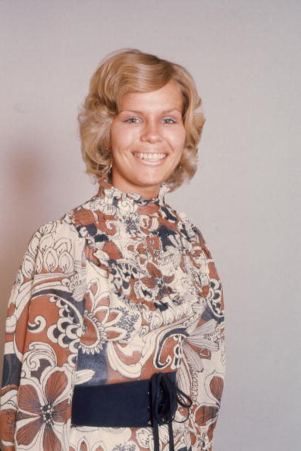 Blonde model in paisley blouse 