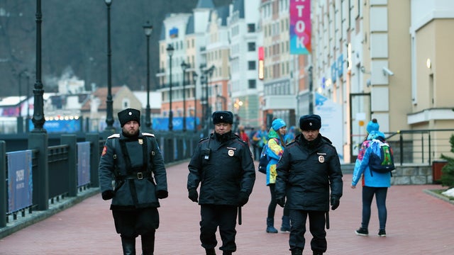 Police security patrol the Rosa Khutor Mountain Cluster village ahead of the Sochi 2014 Winter Olympics, 