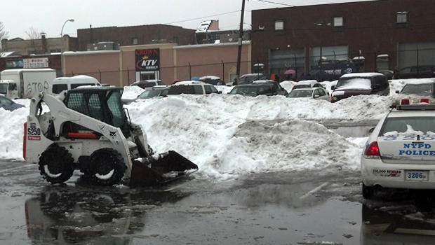 A private snowplow fatally struck a pregnant woman in a parking lot in Brooklyn, N.Y., Feb. 13, 2014. 