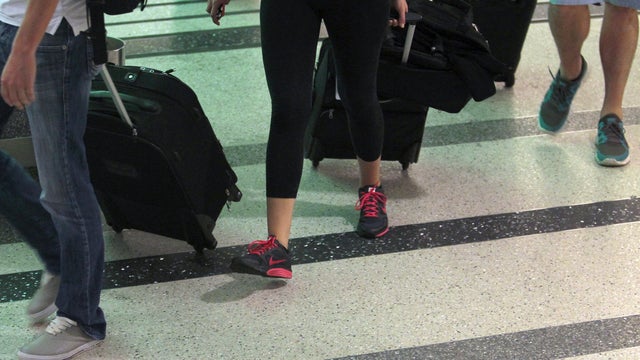 An international air traveler arrives at Tom Bradley International Terminal at Los Angeles International Airport Feb. 19, 2014, in Los Angeles. 