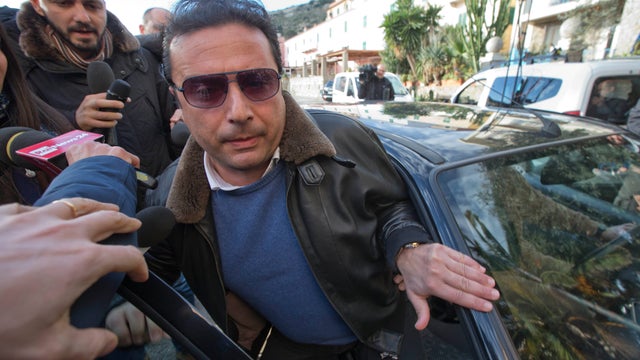 Captain Francesco Schettino arrives for a briefing prior to boarding the wreck of the Costa Concordia cruise ship 