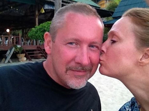 A photo provided by Sarah Bajc shows her kissing long-time boyfriend Phil Wood 