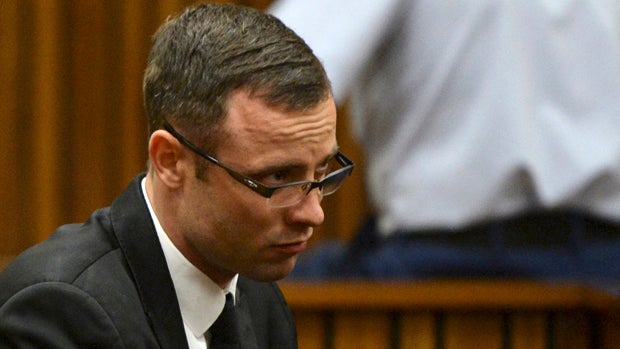 Oscar Pistorius sits in the dock during his murder trial at a court in Pretoria, South Africa, March 14, 2014. 
