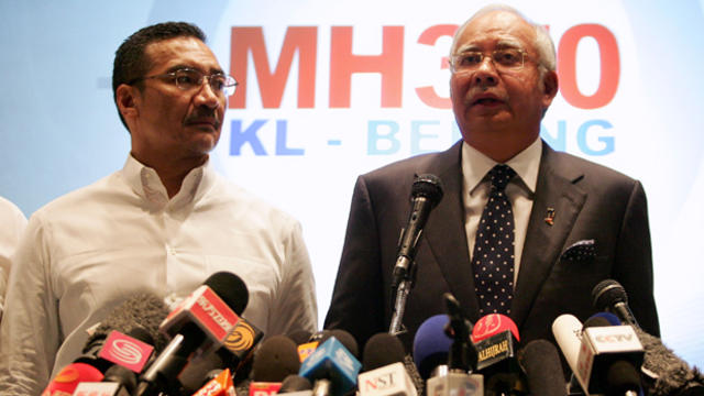 Datuk Hishammuddin Hussein, left,, acting minister of transport, and Malaysian Prime Minister Najib Abdul Razak update the media on the search and rescue plan for the missing Malaysia Airlines Flight MH370 during a press conference March 15, 2014, in Kual 