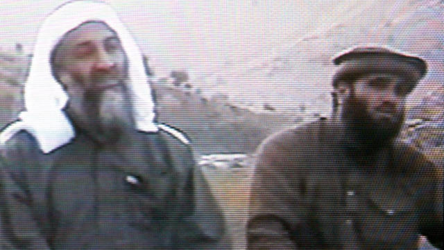 This frame grab from the Saudi-owned television network MBC (Middle East Broadcasting Center) shows Osama bin Laden, left, sitting next to Suleiman Abu Ghaith, the spokesman of his al Qaeda network, in an undated videotape broadcast by the Dubai-based MBC 