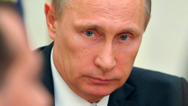 Russian President Vladimir Putin chairs a meeting with Security Council members at the Kremlin 