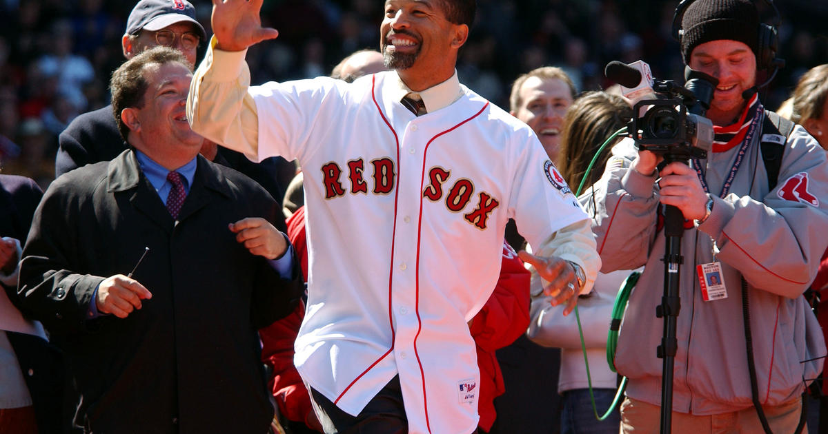 Boston Red Sox catcher Jason Varitek waves to the crowd at Fenway Park as  he walks out to receive his 2007 World Series ring in a ceremony before the Red  Sox home