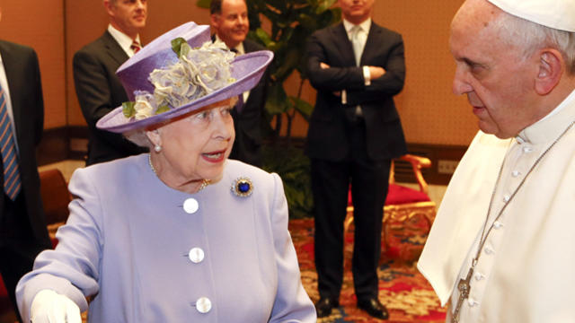 Britain's Queen Elizabeth II talks with Pope Francis at the Vatican April 3, 2014. 