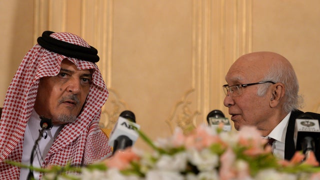 Pakistan's Adviser for National Security and Foreign Affairs Sartaj Aziz (R) speaks with Saudi Foreign Minister, Prince Saud al-Faisal 
