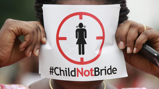 A woman protests against underage marriages in Lagos, Nigeria 