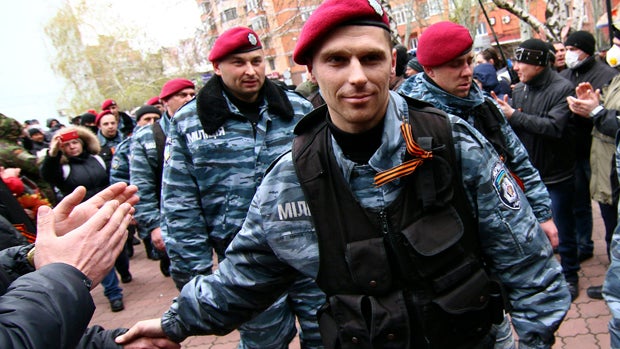 Members of the disbanded Ukrainian riot police unit Berkut arrive to support pro-Russian protesters in Donetsk, Ukraine, April 12, 2014. 