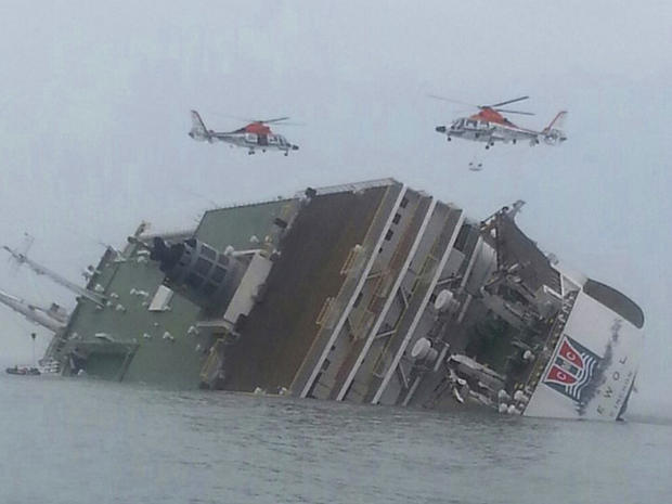 Helicopters hover over a South Korean passenger ferry as it sinks off the nation's southwest coast 