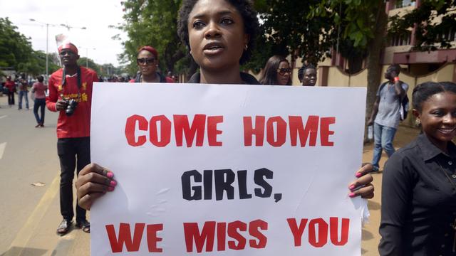 A woman carries placard to press for the release of missing Chibok school girls during a rally by civil society in Lagos 