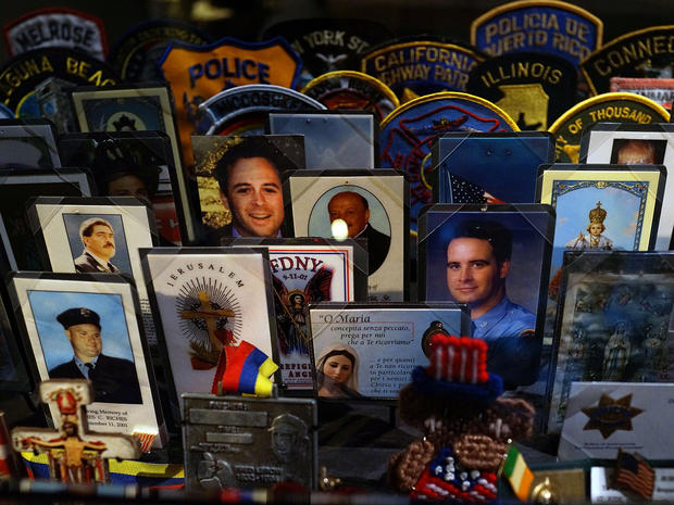 Cards, patches and mementos of those killed at ground zero are viewed during a preview of the National September 11 Memorial & Museum May 14, 2014, in New York City. 