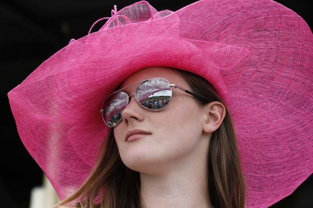 Alli Shepard wears a hat before the 139th Preakness Stakes at Pimlico Race Course in Baltimore May 17, 2014. 