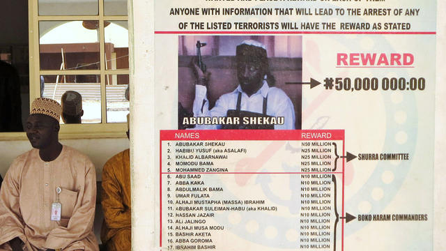 A poster advertising a reward in the search for Boko Haram leader Abubakar Shekau and other fighters 