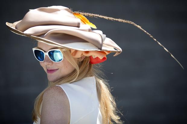 Mary Frances Dale poses for a portrait with her colorful hat before the 146th running of the 2014 Belmont Stakes in Elmont, New York, June 7, 2014. 