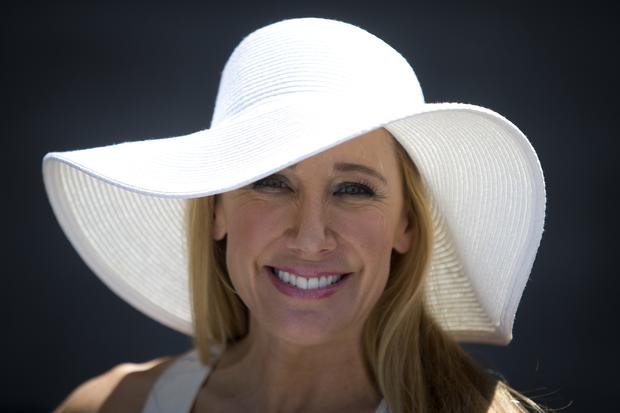 Diana Val poses for a portrait with her hat before the 146th running of the 2014 Belmont Stakes in Elmont, New York, June 7, 2014. 