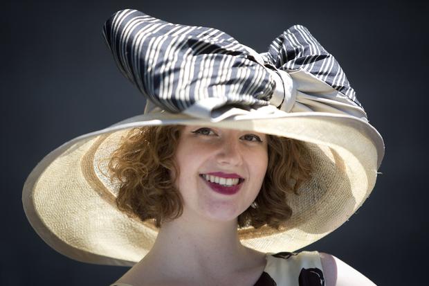 Kendall Owings poses for a portrait with her hat before the 146th running of the 2014 Belmont Stakes in Elmont, New York, June 7, 2014. 