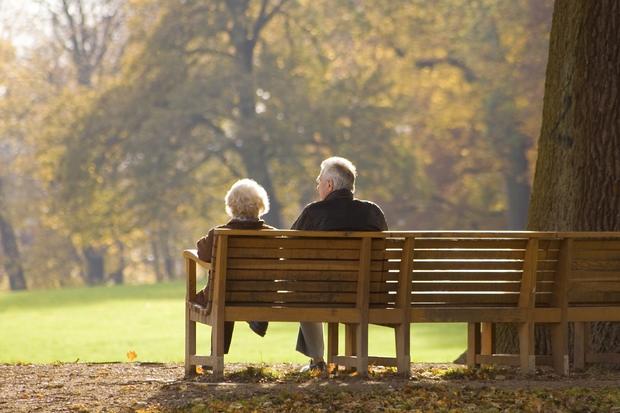 elderly couple sitting 