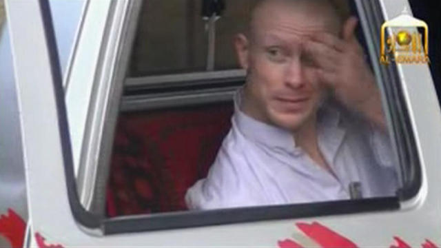 U.S. Army Sergeant Bowe Bergdahl waits in a pick-up truck before he is freed 
