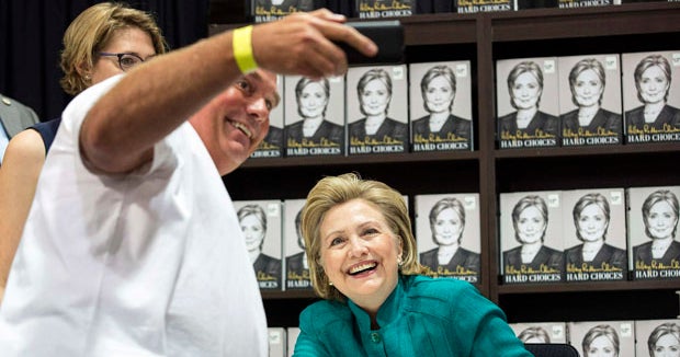 A surprise visitor stops by Hillary Clinton's book signing - CBS News