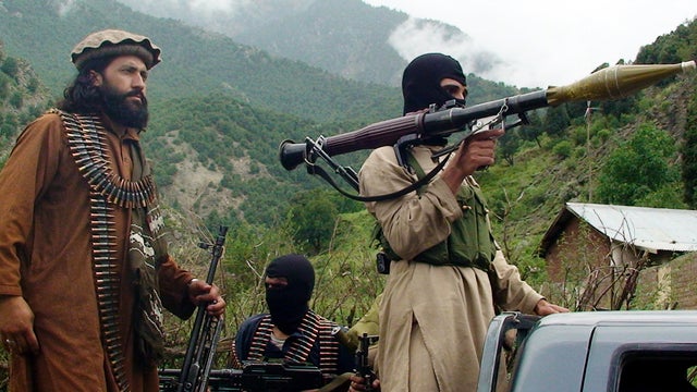 Pakistani Taliban are seen on patrol in their stronghold of Shawal in the Pakistani tribal region of South Waziristan Aug. 5, 2012. 