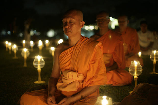 Buddhist monks meditate 