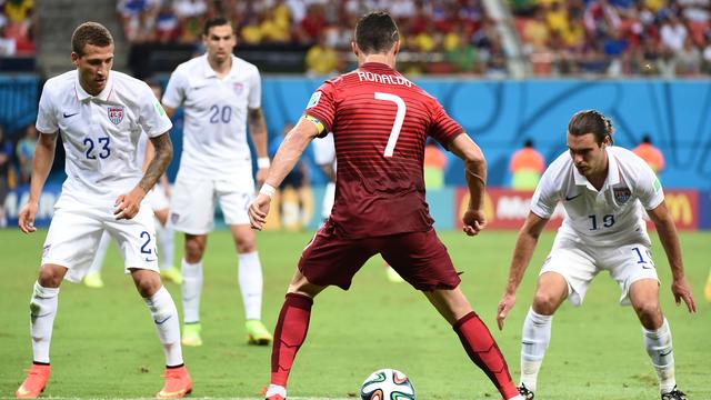 U.S. midfielder Graham Zusi, right, and U.S. defender Fabian Johnson, left, defend against Portugal's forward Cristiano Ronaldo (second from right) during a Group G match between the U.S. and Portugal in Manaus during the 2014 World Cup 
