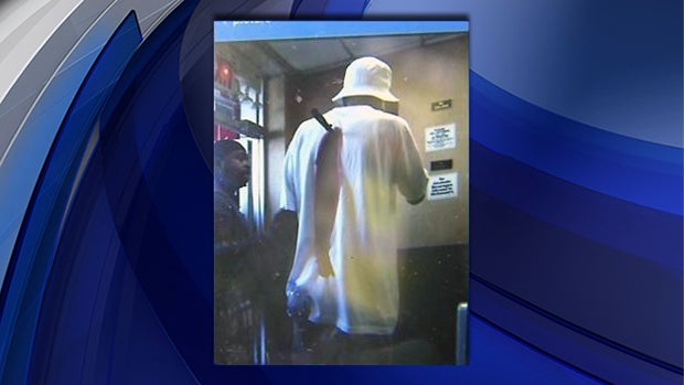​A man is seen with a knife in his back in a McDonald's in Queens, N.Y., June 24, 2014. 