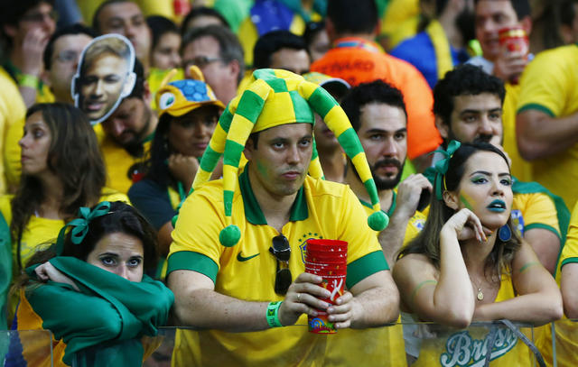 Faces of agony and ecstasy of German, Brazil fans