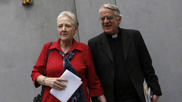 Marie Collins, left, and Vatican spokesman father Federico Lombardi leave at the end of a press conference at the Vatican 