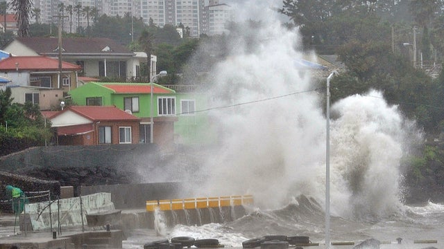Waves crash as Typhoon Neoguri approaches the village in Seogwipo on Jeju Island 