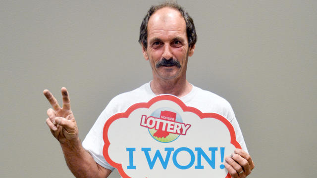 ​Robert Hamilton of Indianapolis is seen after winning his second million-dollar lottery prize at Hoosier Lottery's headquarters in Indianapolis July 22, 2014. 