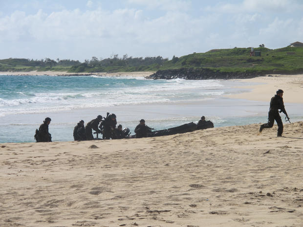 Japanese soldiers on a reconnaissance team come ashore at Kaneohe Bay, Hawaii, during amphibious landing practice July 29, 2014. 