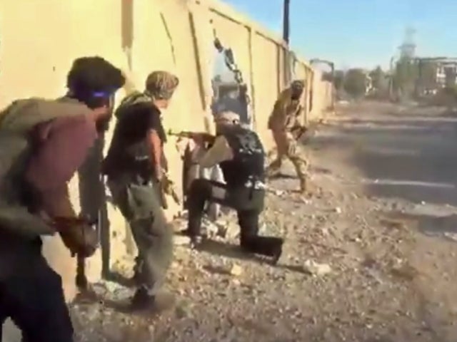 ​Anti-government fighters engage Syrian army forces in a fire fight near the town of Mleiha, a suburb to the southeast of Damascus 