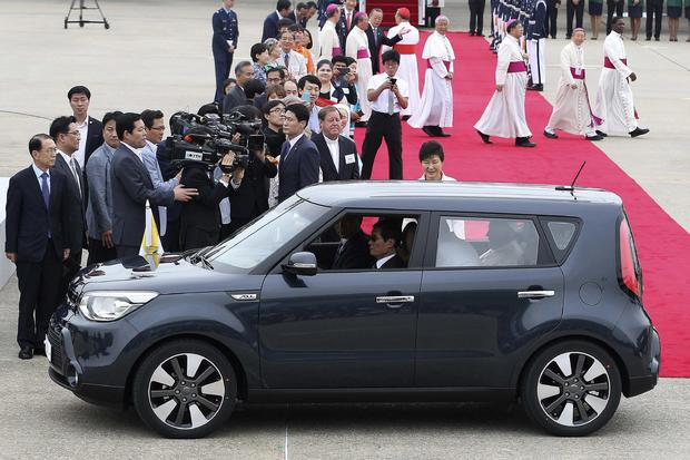 Pope Francis is seen in a Kia Soul car after his arrival at Seoul Air Base in Seongnam, South Korea 