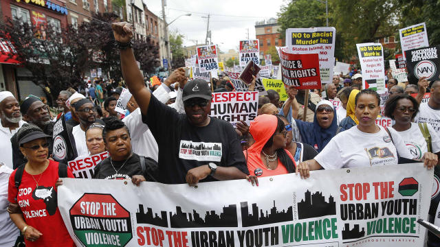 People march during the "We Will Not Go Back" march and rally for Eric Garner in the Staten Island borough of New York Aug. 23, 2014. 