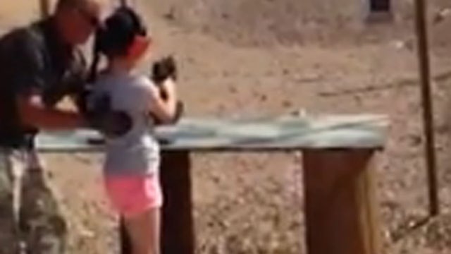 Shooting instructor Charles Vacca is seen in this video image capture giving a lesson on using an Uzi to a 9-year-old girl at a gun range in Arizona Aug. 25, 2014, moments before she accidentally shot him. Vacca died from his wounds later that day. 