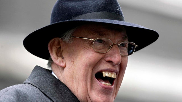 Democratic Unionist Party leader Ian Paisley smiles as he talks to reporters on Downing Street March 22, 2007. 