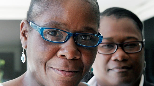 Marlene Pinnock, left, poses with her attorney 